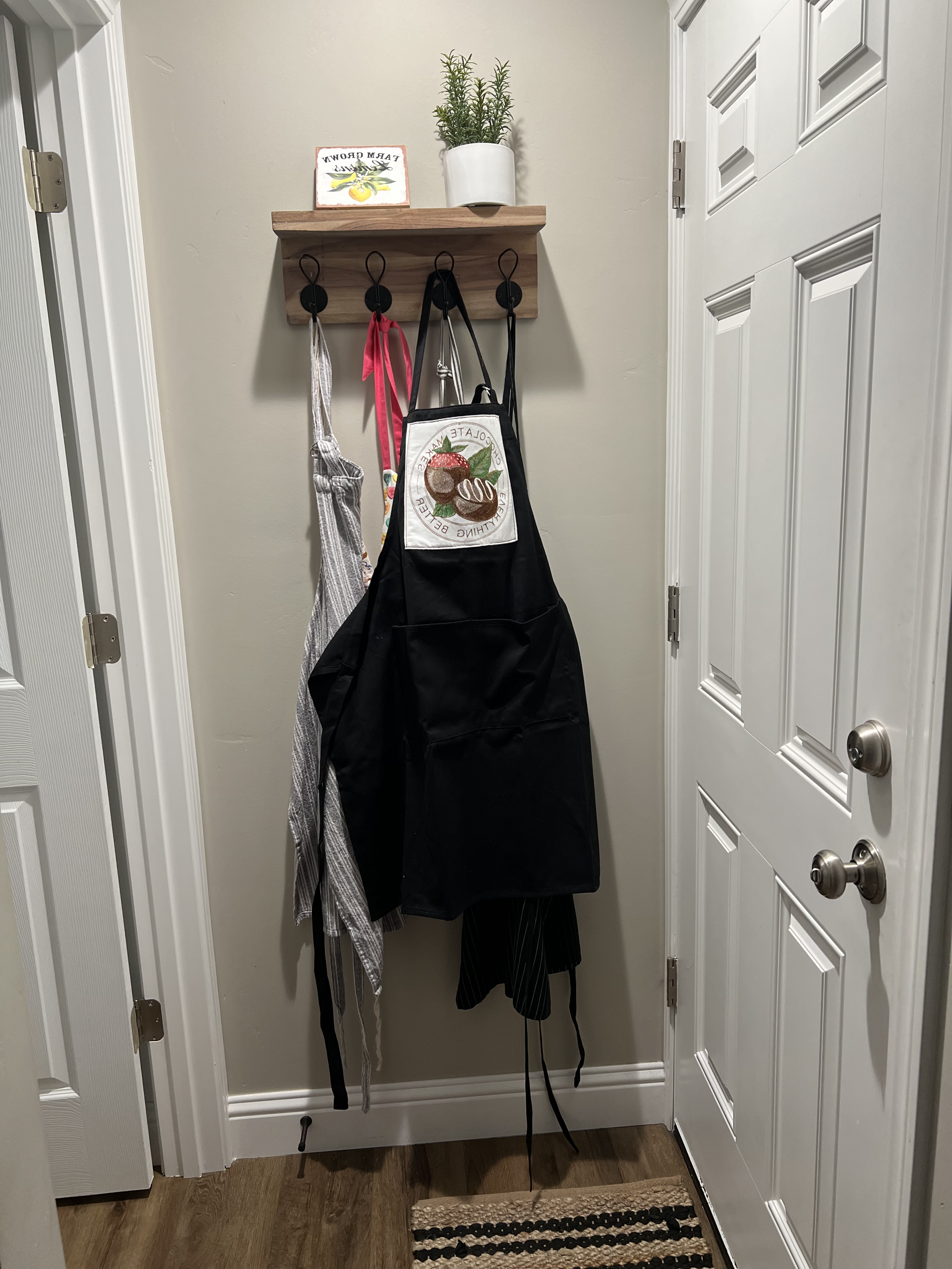 Chocolatier apron hanging on hook