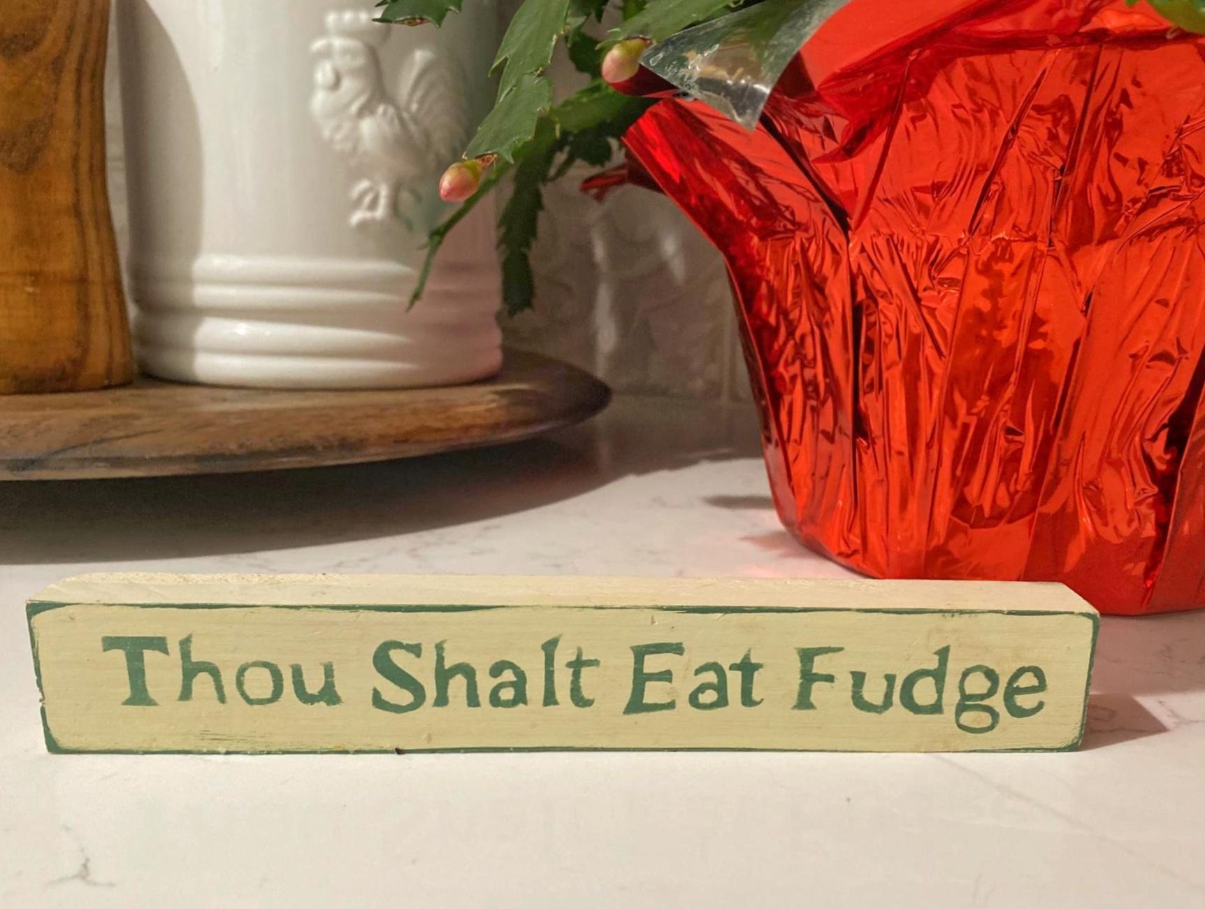 Thou Shalt Eat Fudge wood plaque on a kitchen counter