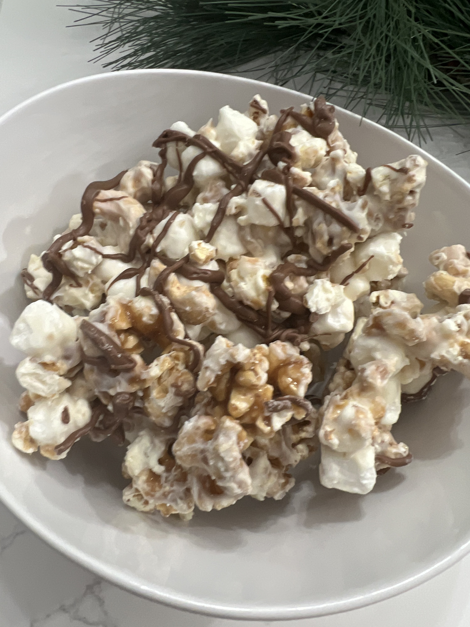 Gourmet popcorn with white chocolate, toffee and drizzled milk chocolate